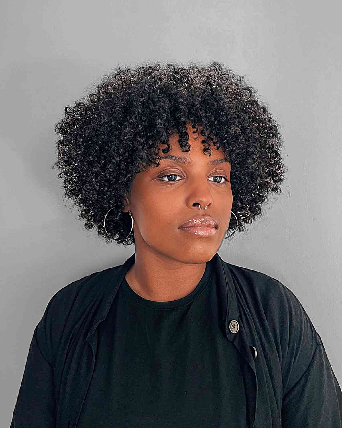 Hair styled with an afro perm