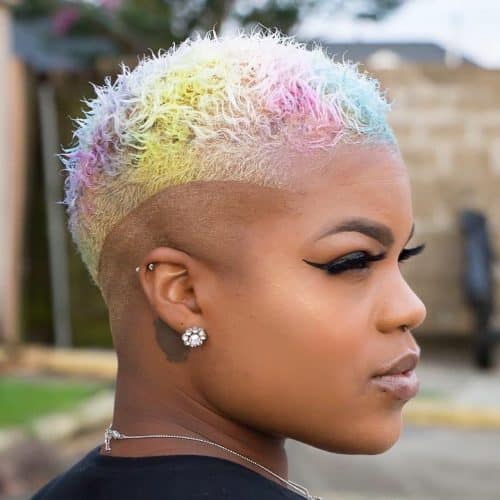 Hair with the sides shaved and colorful rainbow highlights