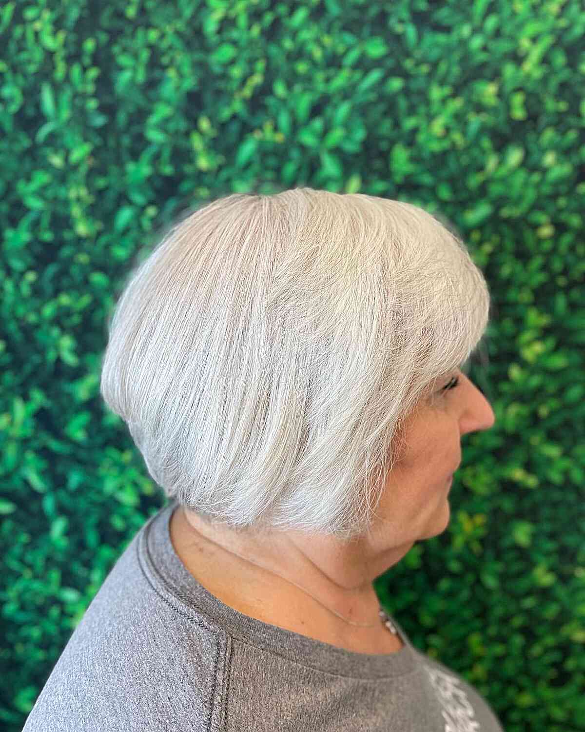 A short bob hairstyle with bangs for platinum white hair