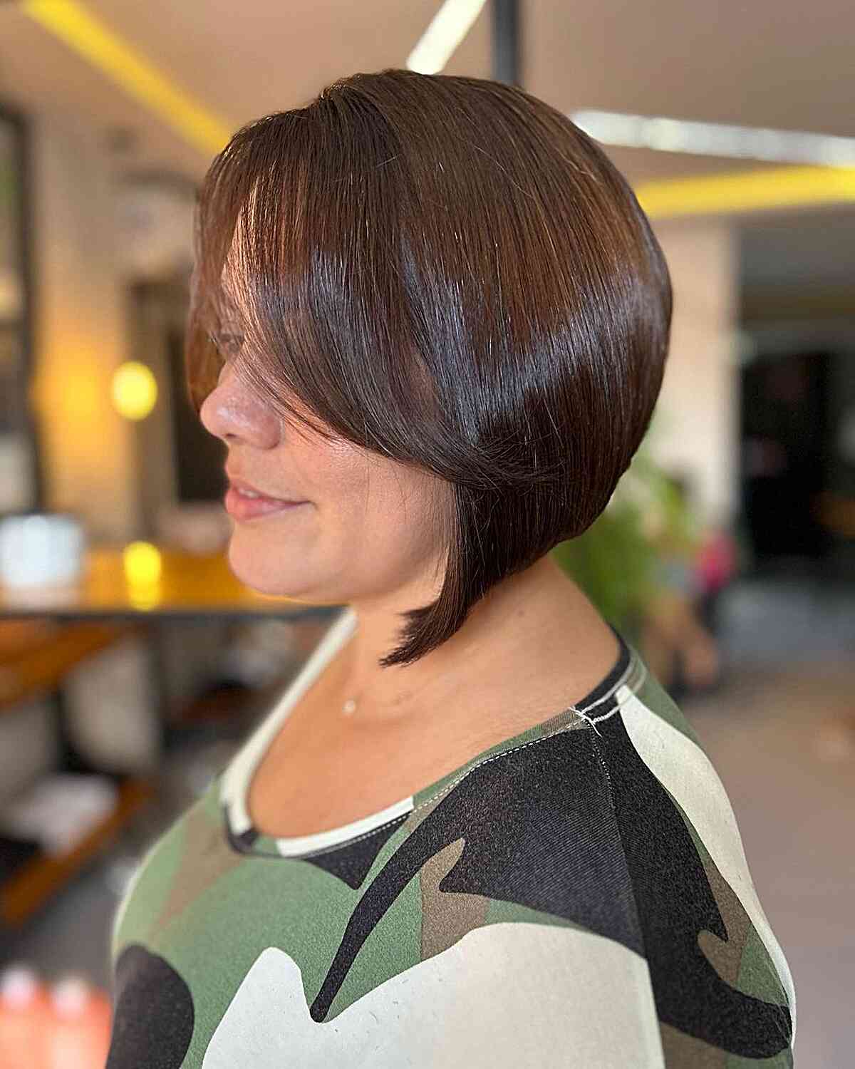 A stylish A-line bob with a short length and a sweeping fringe