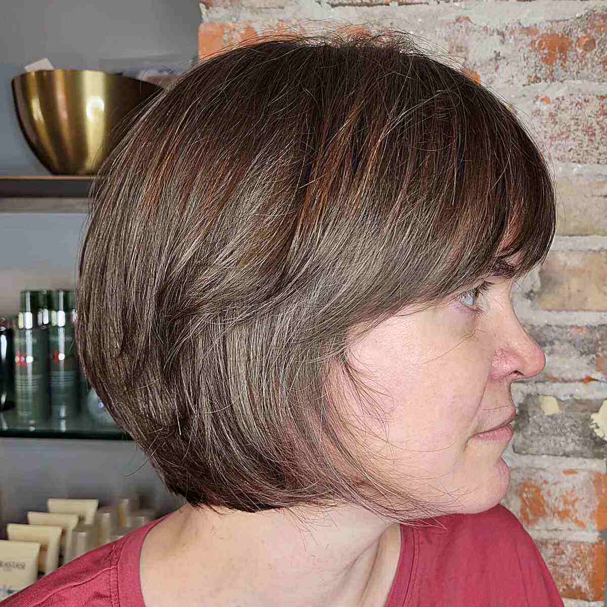 A chocolate brown bob with curved bangs