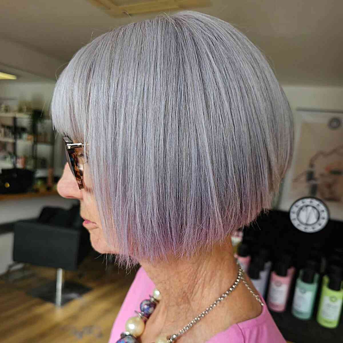 A smooth razored bob hairstyle with a fringe