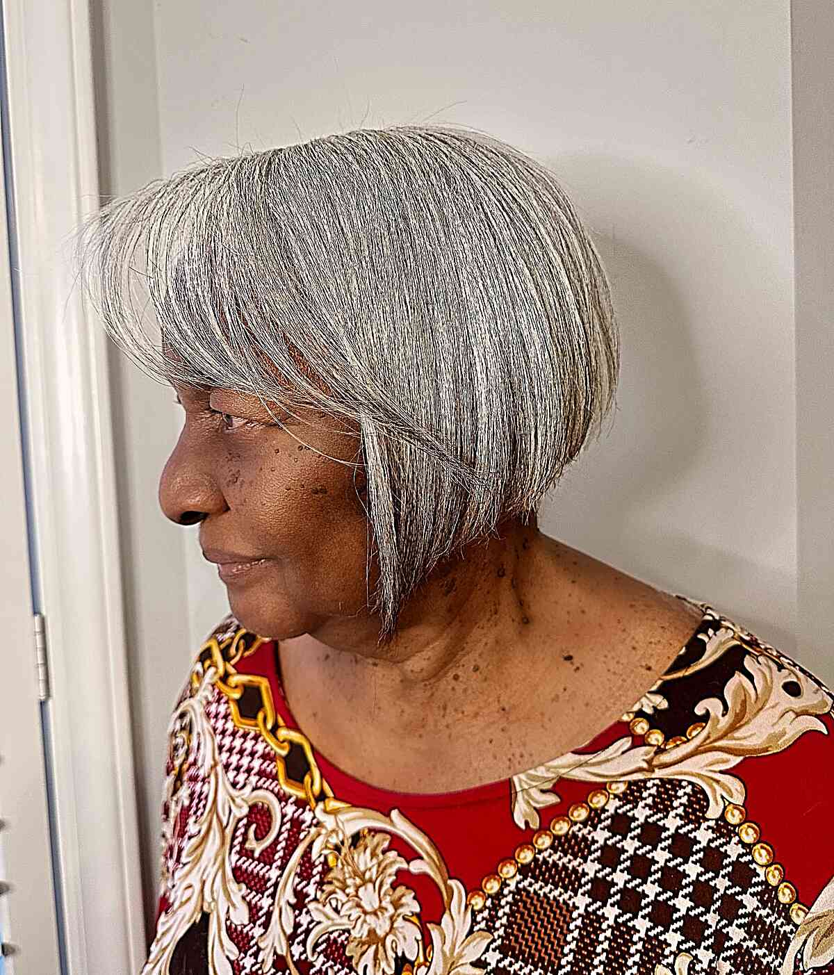 A silver bob with graduated layers ideal for mature women.