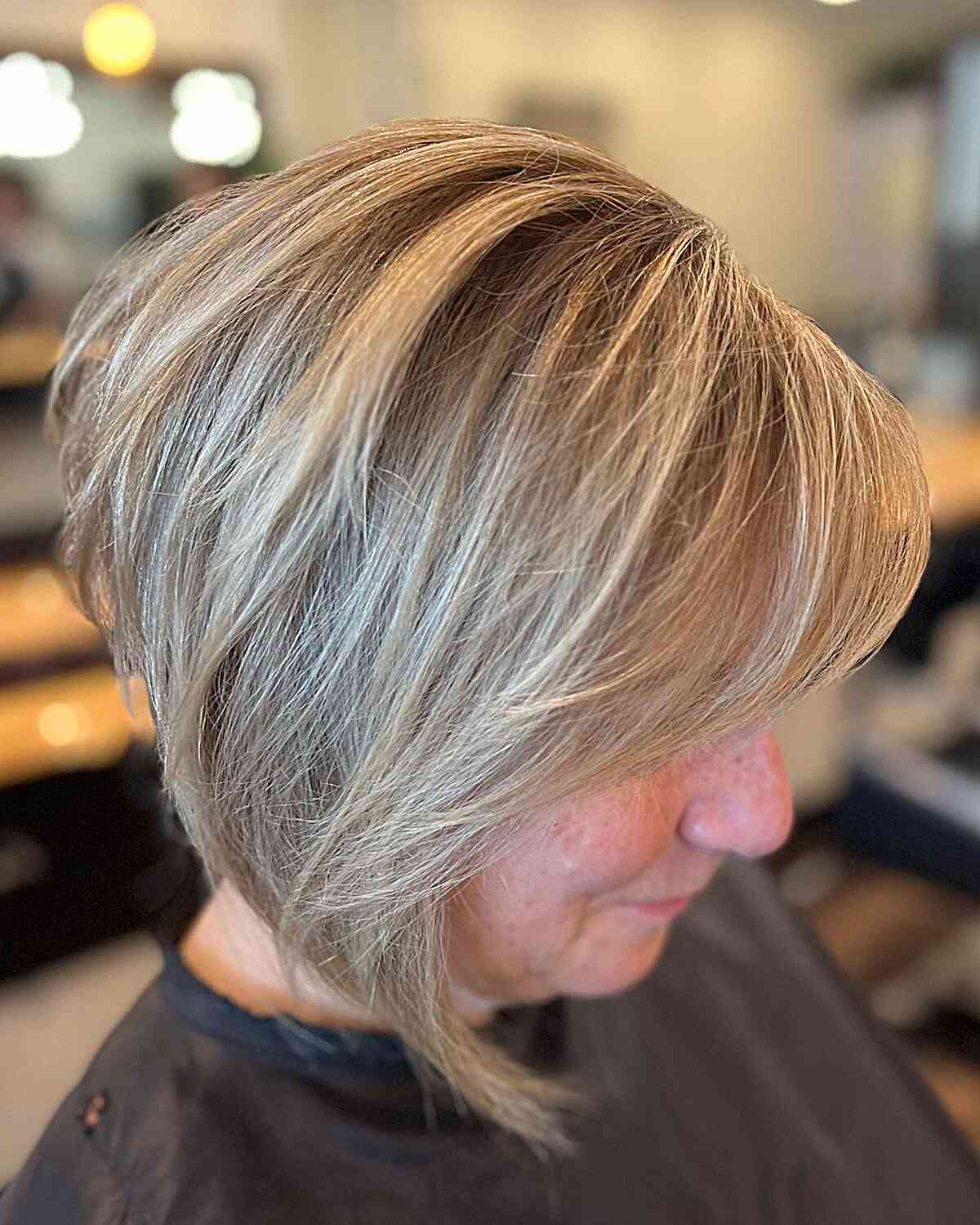 Stacked bob haircut in icy blonde shade for fine hair