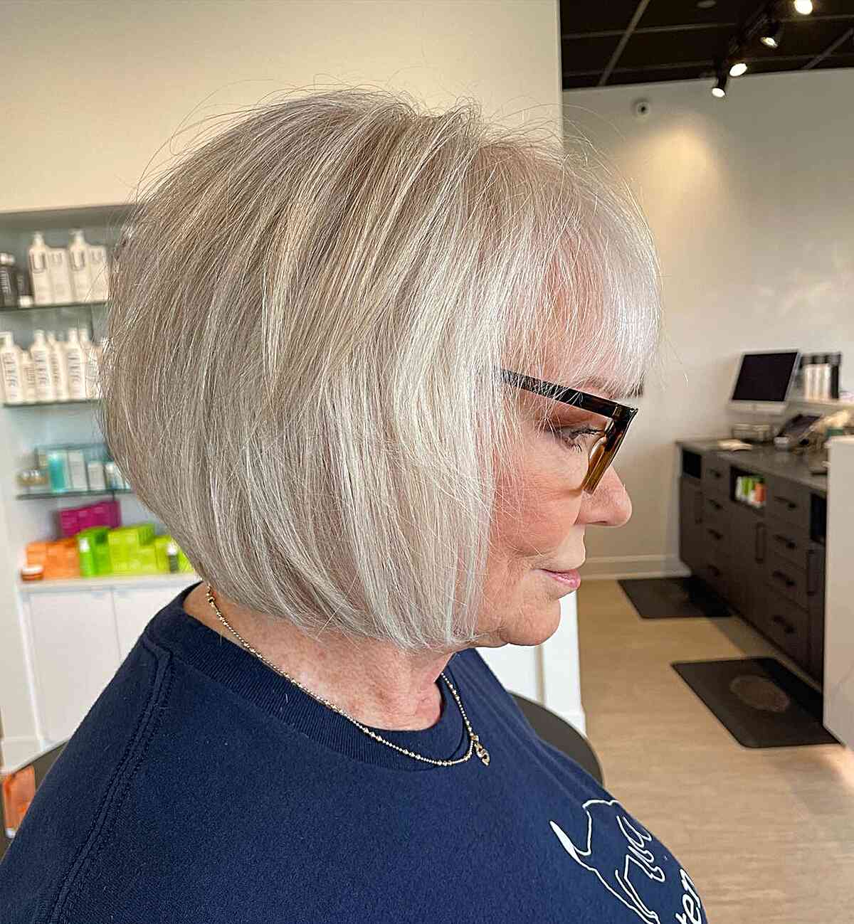 Bob haircut in a platinum shade with see-through bangs