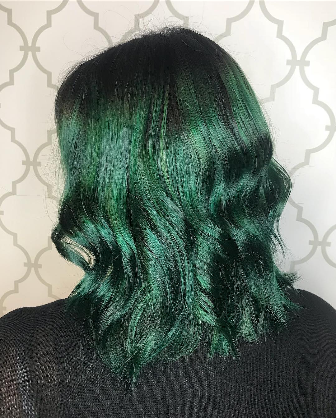 Hair color in an emerald green shade
