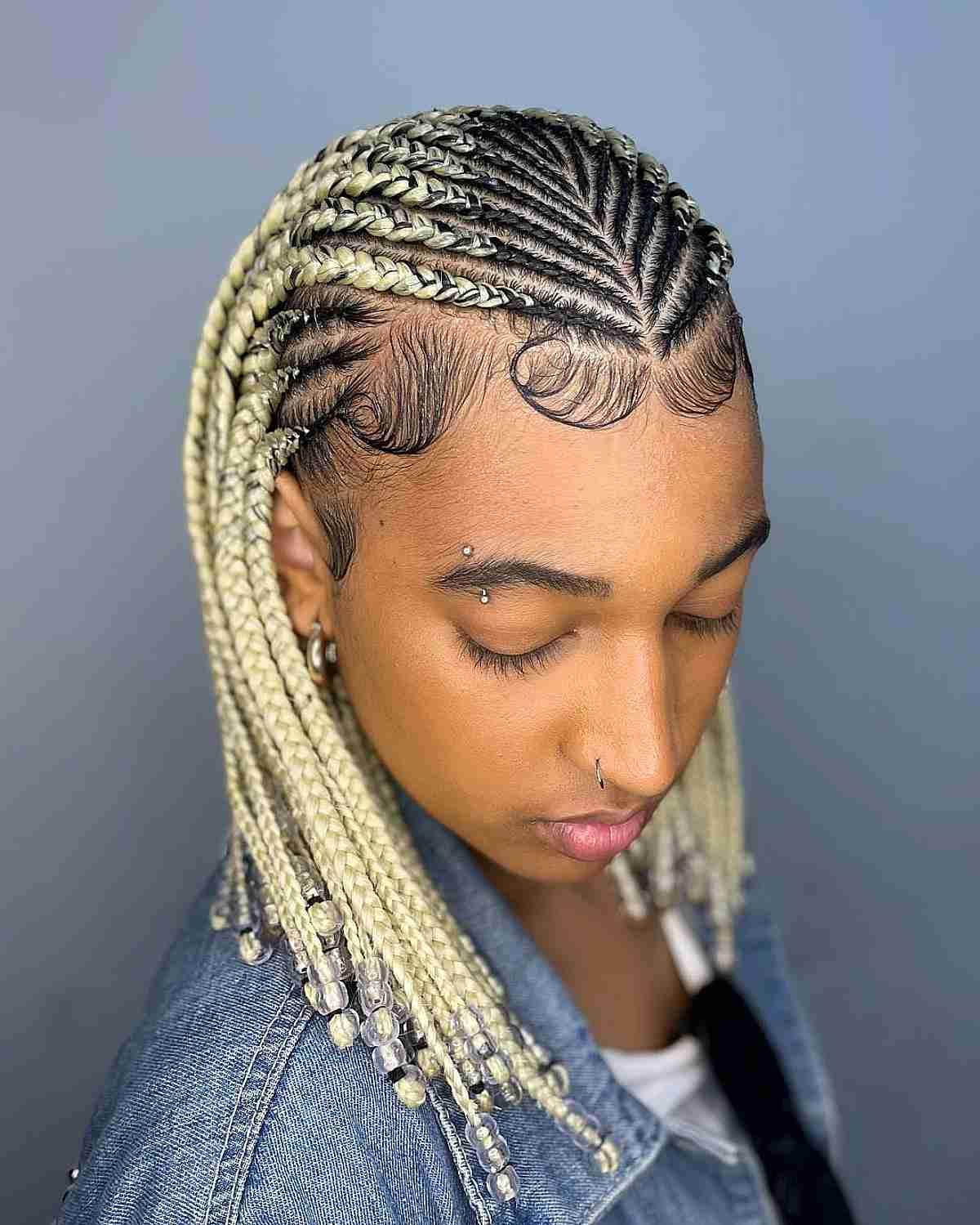 Blonde Hair in Ghana Braids Adorned with Edges and Beads