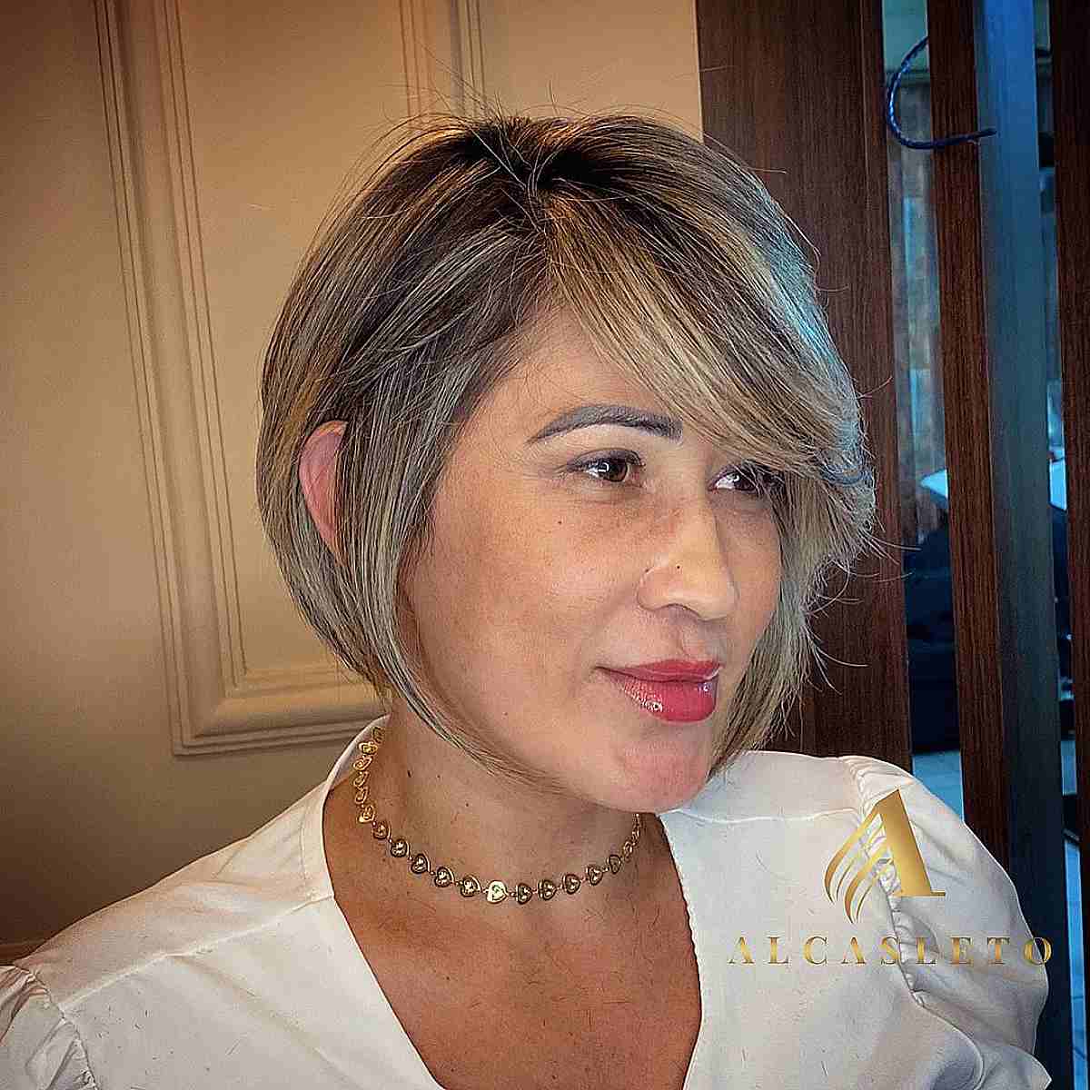 Wedge bob with a side fringe in a bronde hue