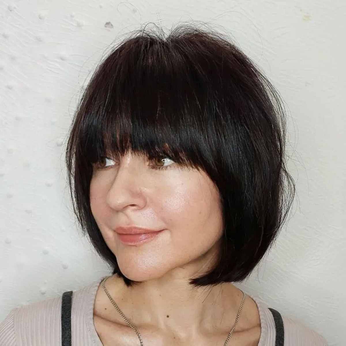 Thick Bob with Bangs Reaching Neck Length