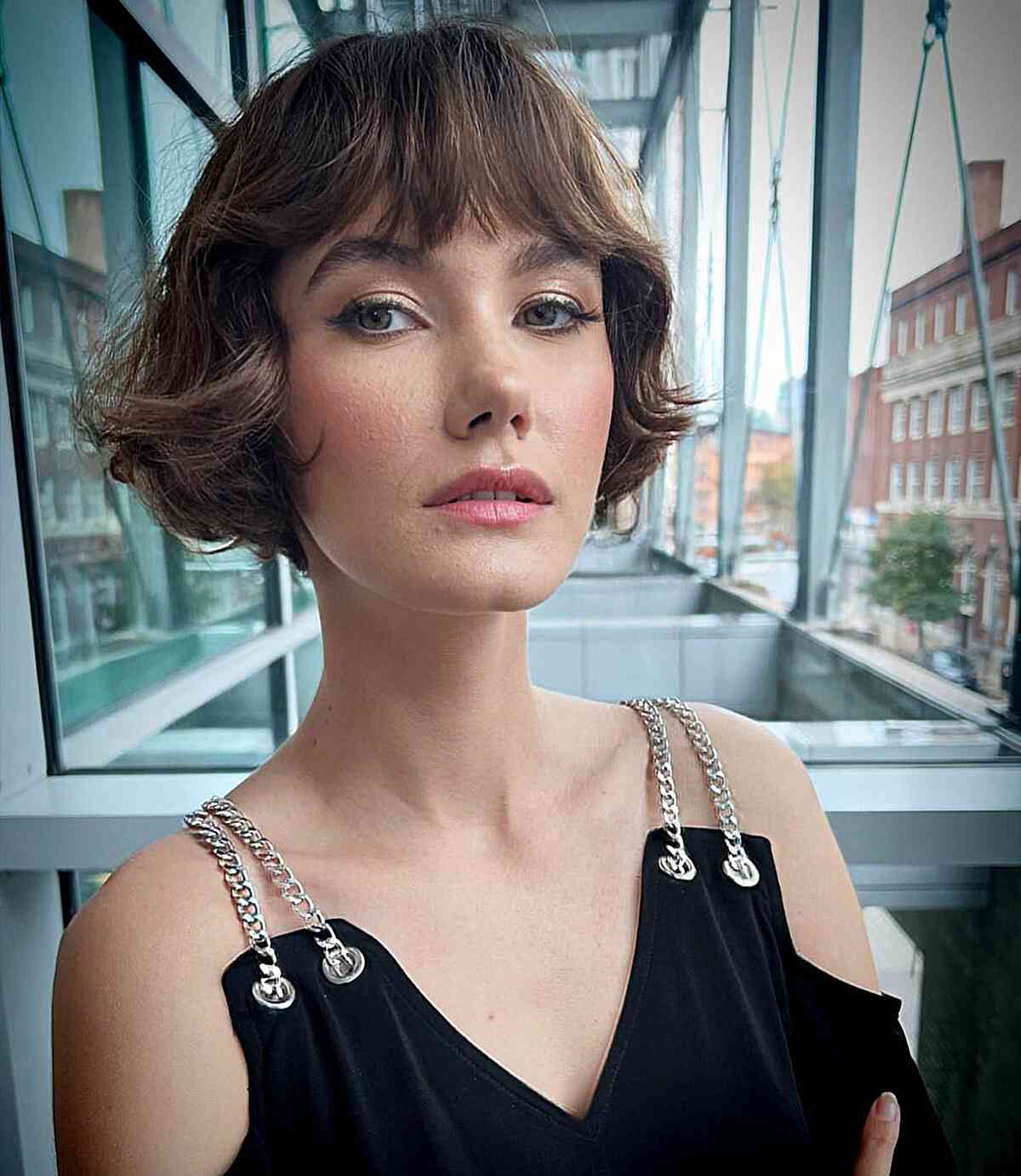 Enhance Your Features with a Wavy French Brunette Bob