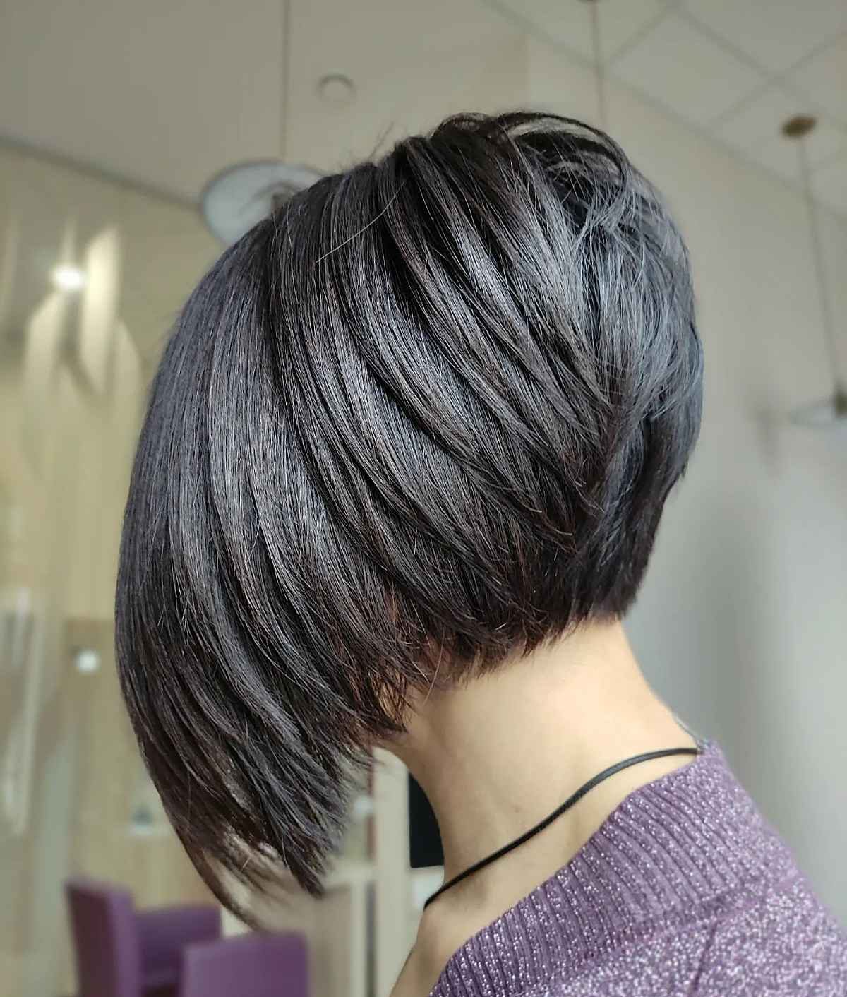 View the back of a short, stacked, and layered hairstyle