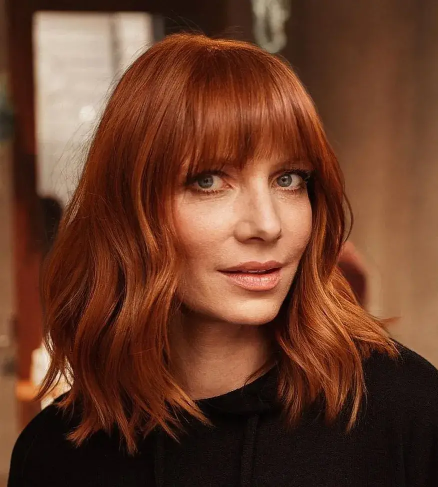 Sleek Copper Hair with Thick Bangs