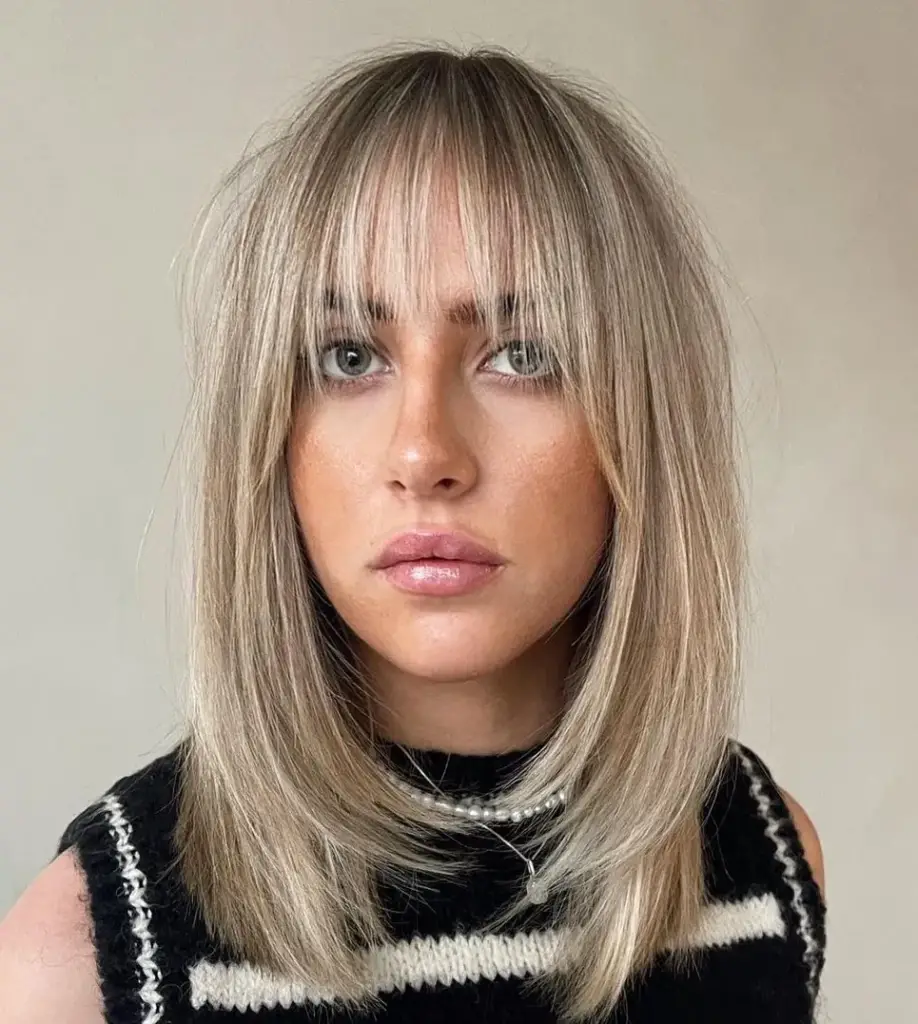 Medium-Length Hair with Extended Layered Bangs