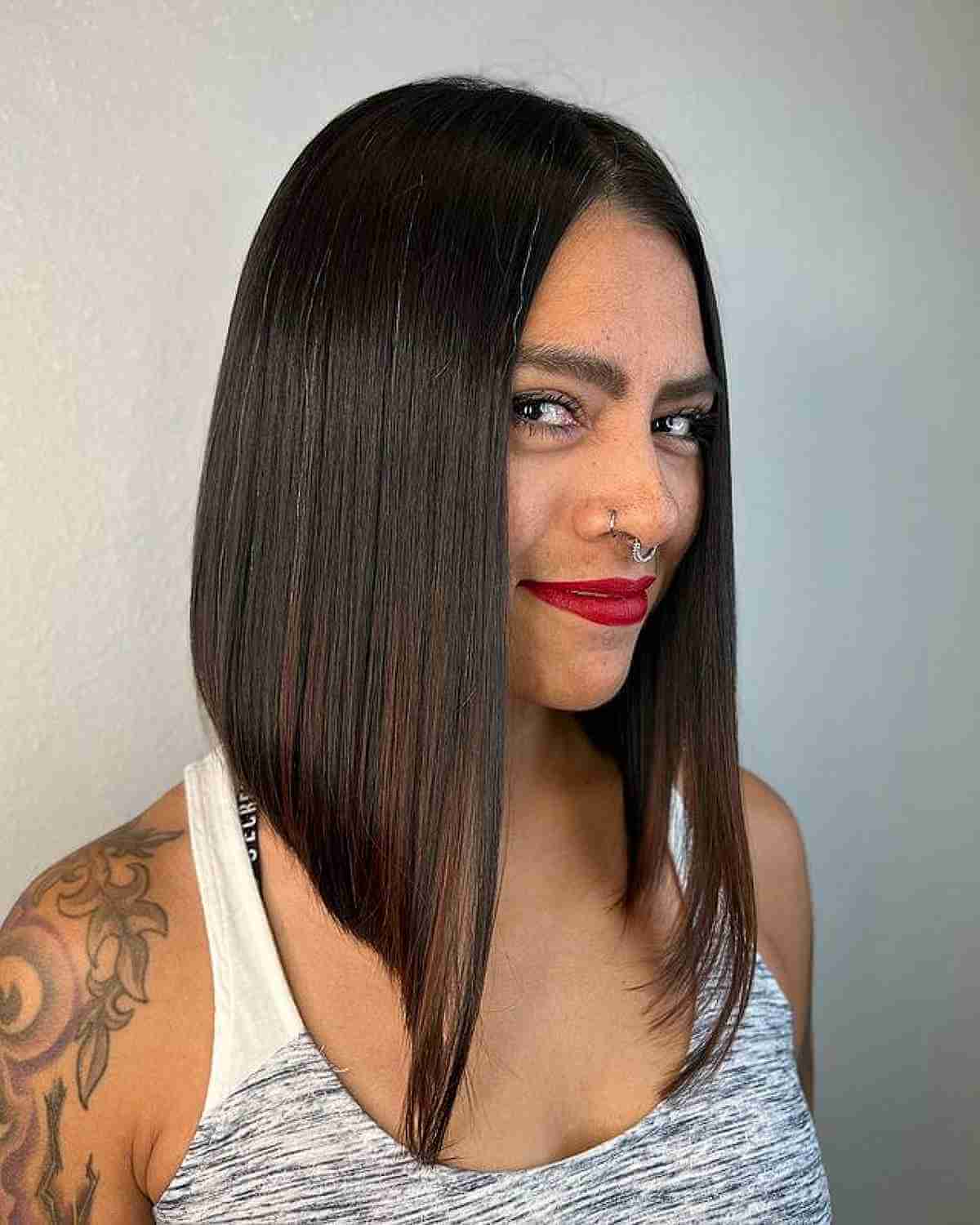 Sleek and Modern: Mid-Length Inverted Bob with Center Part
