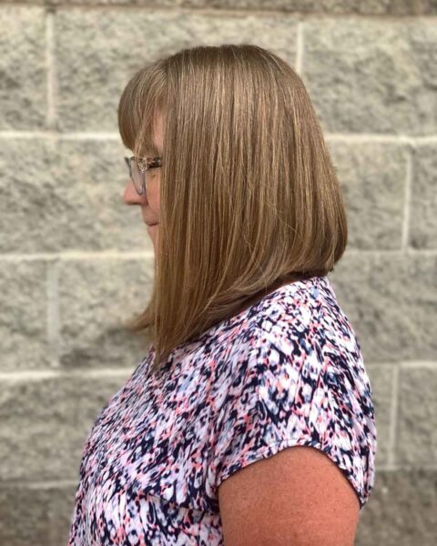 Stunning Shoulder-Length Angled Bob Enhanced By Face-Framing Bangs